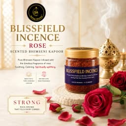 An elegant glass jar of amber-tinted Blissfield Incence Rose camphor crystals resting on a carved wooden base, surrounded by scattered red rose petals, clear raw crystals, and a smoking ornate bronze censer.